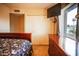 Bedroom features sliding closet, dresser and window with natural light at 919 W Lodge Dr, Tempe, AZ 85283