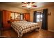 Main bedroom featuring built-in cabinets and mirrors with a large bed in front of a window at 919 W Lodge Dr, Tempe, AZ 85283