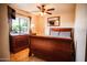 Bedroom with ceiling fan, dresser and window with natural light at 919 W Lodge Dr, Tempe, AZ 85283