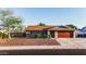 Charming single-level home with desert landscaping, brick accents, and a two-car garage at 919 W Lodge Dr, Tempe, AZ 85283