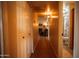 Inviting hallway view leading to a cozy living room and well-lit bathroom at 919 W Lodge Dr, Tempe, AZ 85283