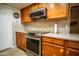 Bright kitchen featuring stainless steel appliances and stylish tile backsplash at 919 W Lodge Dr, Tempe, AZ 85283