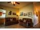 Comfortable living room featuring two brown sofas, neutral walls, and decor with a ceiling fan at 919 W Lodge Dr, Tempe, AZ 85283