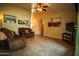 Inviting living room boasts tile floors, neutral walls, a ceiling fan and comfortable seating at 919 W Lodge Dr, Tempe, AZ 85283