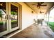 Inviting covered patio with brick siding, ceiling fans, and outdoor dining set for relaxing and entertaining at 919 W Lodge Dr, Tempe, AZ 85283