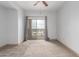 Bright bedroom with an open balcony, neutral carpet and curtains for a comfortable atmosphere at 9820 N Central Ave # 224, Phoenix, AZ 85020