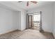 Bright bedroom with sliding glass doors that lead to a balcony at 9820 N Central Ave # 224, Phoenix, AZ 85020