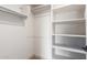 Walk-in closet with carpet flooring, white walls, and shelving to maximize storage and create organized spaces at 9820 N Central Ave # 224, Phoenix, AZ 85020