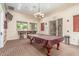 The game room boasts a pool table and bar seating, perfect for socializing and enjoying leisure time at 9820 N Central Ave # 224, Phoenix, AZ 85020