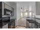 Modern kitchen featuring stainless appliances, sleek countertops, and ample cabinet space at 9820 N Central Ave # 224, Phoenix, AZ 85020