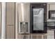 State-of-the-art refrigerator with water dispenser and glass door display at 9820 N Central Ave # 224, Phoenix, AZ 85020