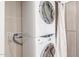 Efficient laundry room with a stacked washer and dryer, optimizing space and convenience at 9820 N Central Ave # 224, Phoenix, AZ 85020