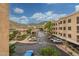 Outside view showing the parking and building through a screen at 9820 N Central Ave # 224, Phoenix, AZ 85020