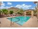 Community pool with lounge chairs, covered area, and mountain views at 9820 N Central Ave # 224, Phoenix, AZ 85020