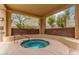Community spa area with pool rules and mountain view at 9820 N Central Ave # 224, Phoenix, AZ 85020