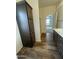 Bathroom with dark wood cabinet, double sinks, a shower and a view into the bedroom at 10231 E Illini St, Mesa, AZ 85208