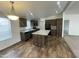 Bright kitchen with stainless steel appliances, a center island, tile flooring, and dark cabinetry at 10231 E Illini St, Mesa, AZ 85208