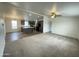 Open floor plan with carpet living room and kitchen with island at 10231 E Illini St, Mesa, AZ 85208
