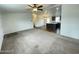 Spacious living room with kitchen island, carpet floors and fan at 10231 E Illini St, Mesa, AZ 85208