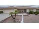 Charming single-story home featuring a well-manicured front yard and a two-car garage at 11012 E Knowles Ave, Mesa, AZ 85209