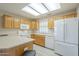 Bright kitchen with light wood cabinets and modern appliances, offering functionality and style at 11012 E Knowles Ave, Mesa, AZ 85209