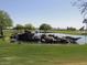 This community features a manicured green space with a pond and small water feature at 11012 E Knowles Ave, Mesa, AZ 85209
