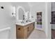 Elegant bathroom with double vanity, modern mirrors, and door to exterior at 1142 E Encinas Ave, Gilbert, AZ 85234