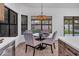 Dining area with modern chandelier and backyard view at 1142 E Encinas Ave, Gilbert, AZ 85234