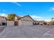 Inviting single-Gathering home with desert landscaping, a two-car garage, and a tiled roof at 1142 E Encinas Ave, Gilbert, AZ 85234