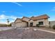 Traditional ranch-style home with a three car garage, desert landscaping and tile roof at 1142 E Encinas Ave, Gilbert, AZ 85234