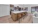 Kitchen featuring an island with bar stool seating, stainless steel appliances, and plenty of cabinet space at 1142 E Encinas Ave, Gilbert, AZ 85234