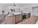 Modern kitchen island with stainless steel oven, light countertops, and wooden cabinets at 1142 E Encinas Ave, Gilbert, AZ 85234