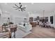 Spacious open-concept living area boasts modern decor, wood floors, and a seamless transition to dining area at 1142 E Encinas Ave, Gilbert, AZ 85234