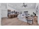 Sunlit open-concept living space featuring vaulted ceiling, island seating, and a seamless transition to the outdoors at 1142 E Encinas Ave, Gilbert, AZ 85234