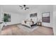 Bright main bedroom featuring a queen bed and plenty of natural light at 1142 E Encinas Ave, Gilbert, AZ 85234