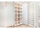 Custom closet with built-in shelving and ample storage space at 12 E Seminole Dr, Phoenix, AZ 85022