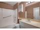 Full bathroom with shower-tub combo and large vanity and sink at 13632 N Silverbell Dr, Sun City, AZ 85351