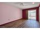 Bedroom with a modern feel with laminate floors and updated decor at 13632 N Silverbell Dr, Sun City, AZ 85351