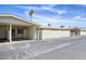 Charming home exterior features a carport, security doors, and easy access to parking at 13632 N Silverbell Dr, Sun City, AZ 85351
