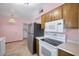Efficient kitchen featuring a stainless steel refrigerator and classic appliances at 13632 N Silverbell Dr, Sun City, AZ 85351