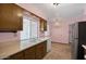Well-lit kitchen boasting ample counter space and a view of the yard at 13632 N Silverbell Dr, Sun City, AZ 85351