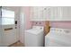 Practical laundry room featuring a washer, dryer, and storage cabinets at 13632 N Silverbell Dr, Sun City, AZ 85351