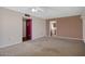 Cozy living room featuring neutral carpet and doorway to kitchen at 13632 N Silverbell Dr, Sun City, AZ 85351