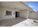 Covered patio with a ceiling fan and access to the interior through sliding glass doors at 13632 N Silverbell Dr, Sun City, AZ 85351