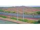 Aerial perspective of highway and canal with views of desert landscape and distant mountains at 140 E Rio Salado Pkwy # 402, Tempe, AZ 85281