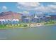 Waterfront view of modern buildings with a mountain backdrop showcases city living at 140 E Rio Salado Pkwy # 402, Tempe, AZ 85281
