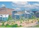 Cityscape featuring modern buildings near a waterfront and walking path with a mountain backdrop at 140 E Rio Salado Pkwy # 402, Tempe, AZ 85281