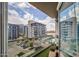 Enjoy the gorgeous views from the balcony of this modern condo, featuring a pool and city buildings at 140 E Rio Salado Pkwy # 402, Tempe, AZ 85281
