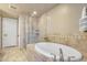 Bathroom showcasing a soaking tub and glass shower at 140 E Rio Salado Pkwy # 402, Tempe, AZ 85281