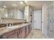 Bathroom featuring a double vanity with decorative marble countertop and backsplash at 140 E Rio Salado Pkwy # 402, Tempe, AZ 85281